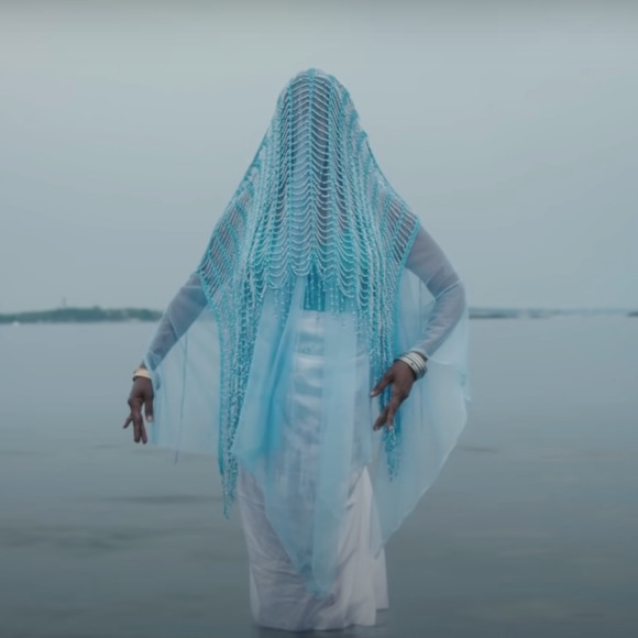 Woman under blue vail from Princess Nokia video clip