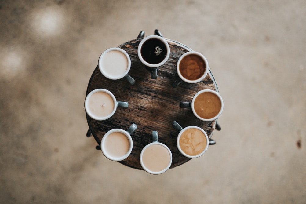 Set of cups with coffee of different shades 