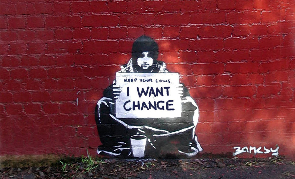 Political street art 'Keep your coins, I want change' by Banksy