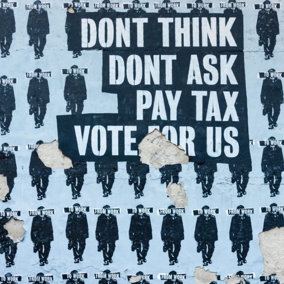 Political street art Don't think, don't ask, pay tax, vote for us