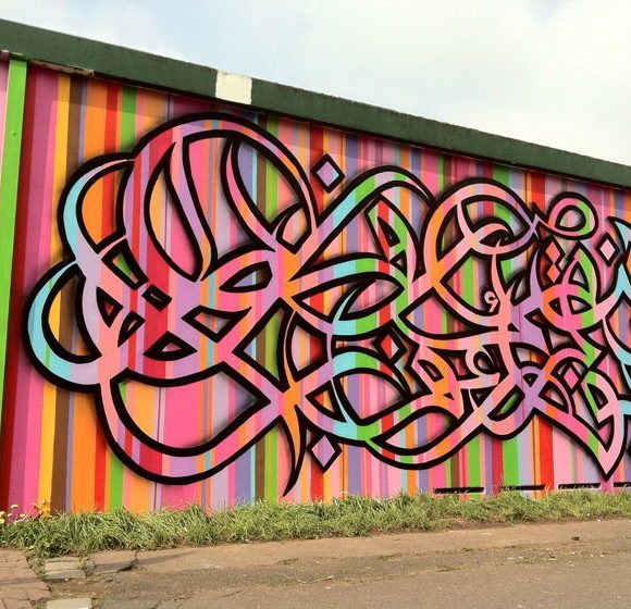 Contemporary street art Arabic calligraphy by El Seed