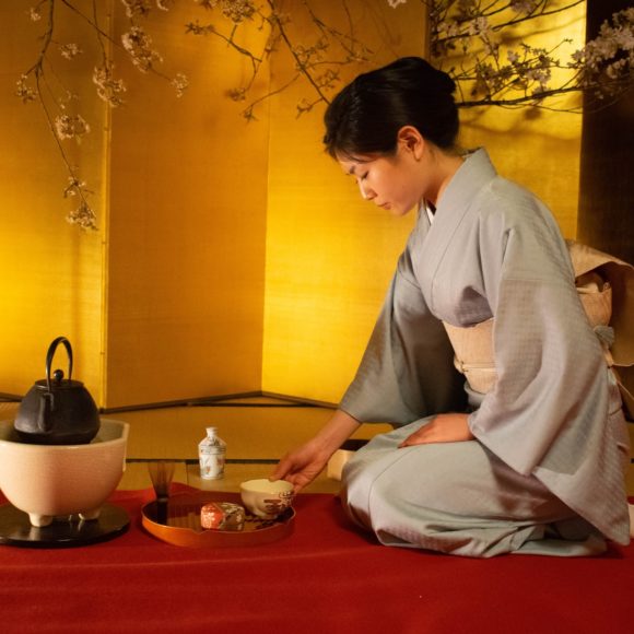 A Japanese woman serving tea