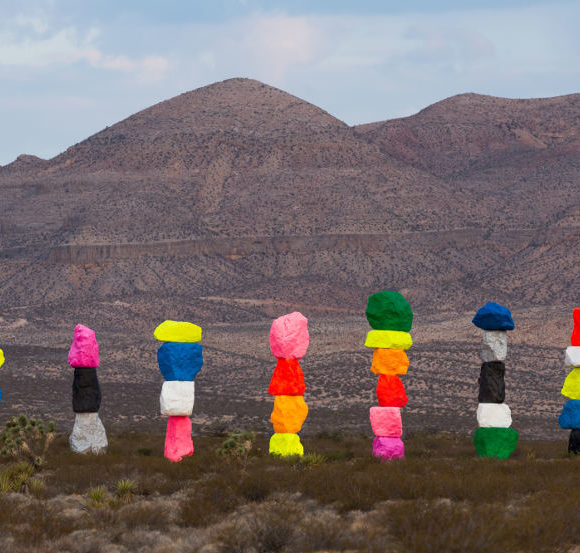 Magic Mountains - art by Ugo Rondinone, colorful stone sculptures in Nevada desert